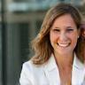 Anna Taylor, Business Analyst at Delta Corp, smiling outside office.