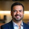 Carlos Rivas, IT Director at Pacific Retail, in a retail office.