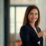 Meghan R., CIO at Stratus Energy, presenting in a boardroom.